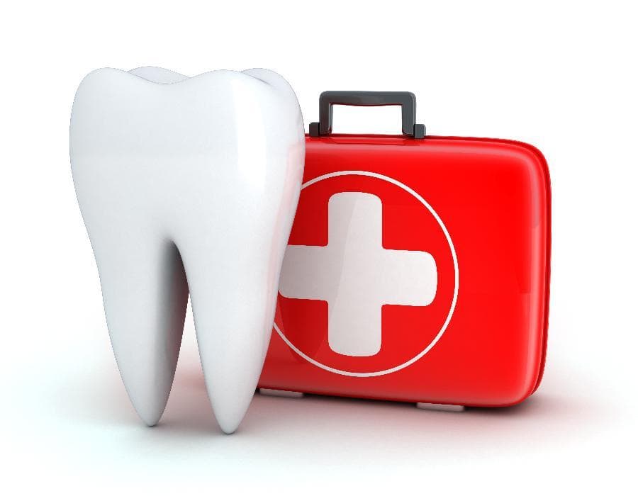 Enlarged tooth next to first aid kit